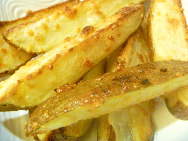 Crispy on the outside and tender on the inside with garlc and melted Parmesan all over the top!  HEAVEN  Savory Garlic Parmesan Potato Wedges - Slice of Southern