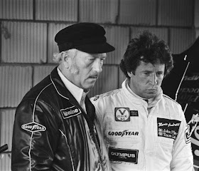 Mario Andretti with Lotus boss Colin Chapman (left) during the 1978 Formula One championship-winning season