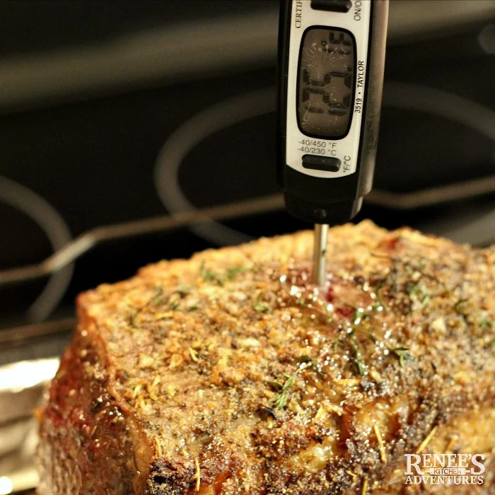Instant read thermometer reads 125 degrees F in Eye of Round Roast