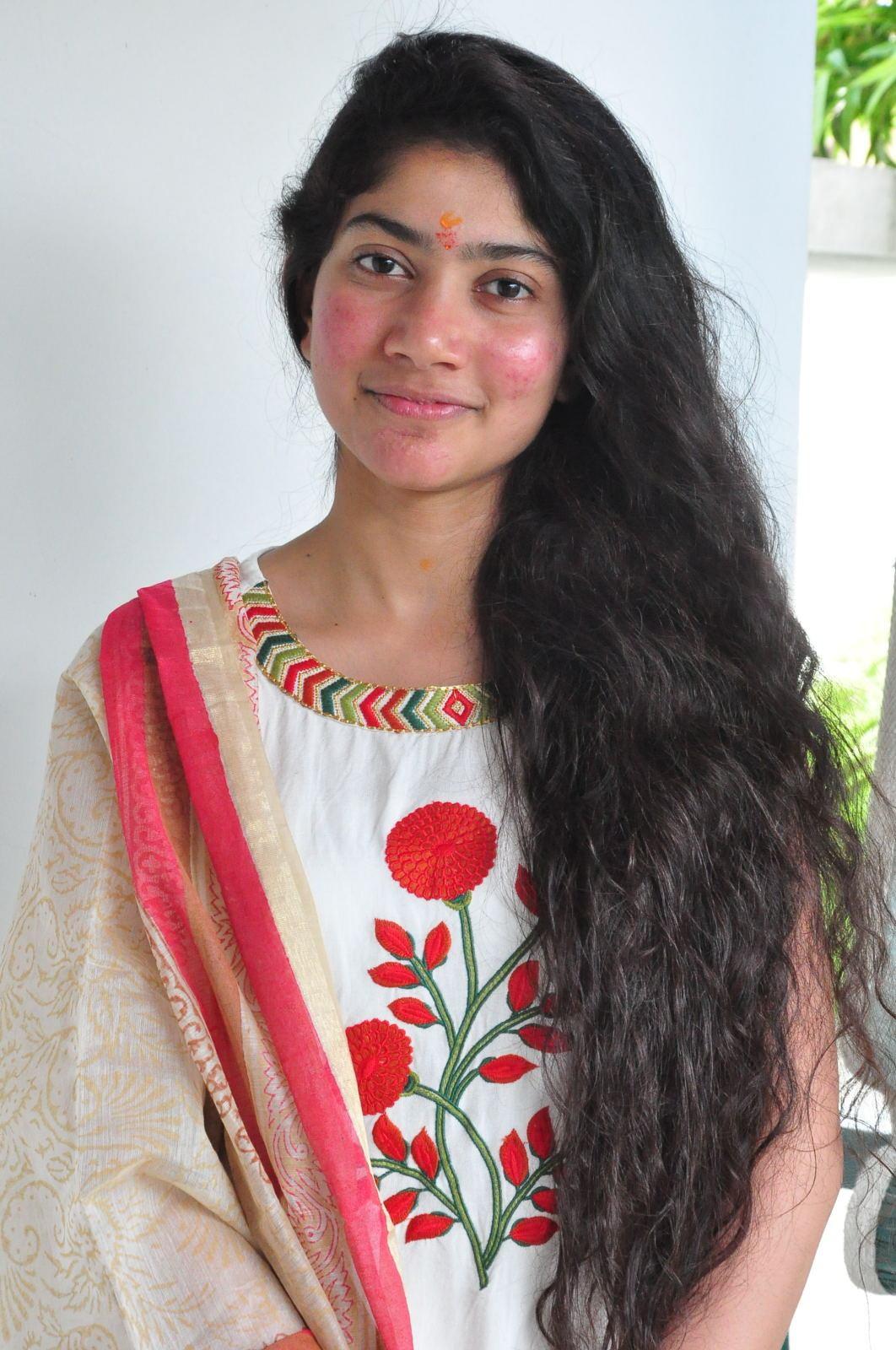 South Indian Actress Sai Pallavi Smiling Stills At Movie Launch In White Dress
