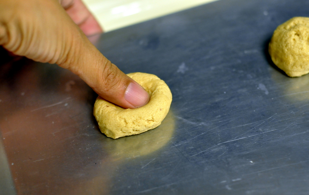 Making the Thumbprint in the Fluffernutter Thumbprint Cookies - Photo by Taste As You Go