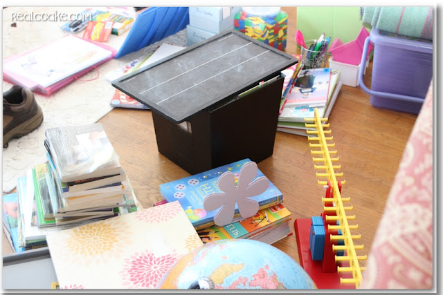 Homeschool organization ideas for organizing all the books and supplies in shelves in the living room. #Organizing #Homeschool #RealCoake