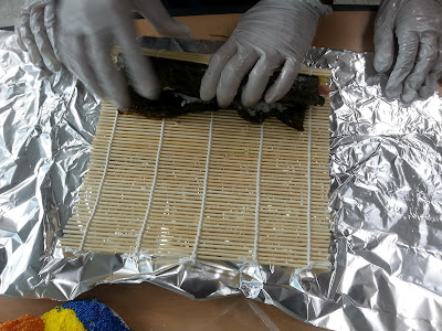 Making and rolling the Kimbap