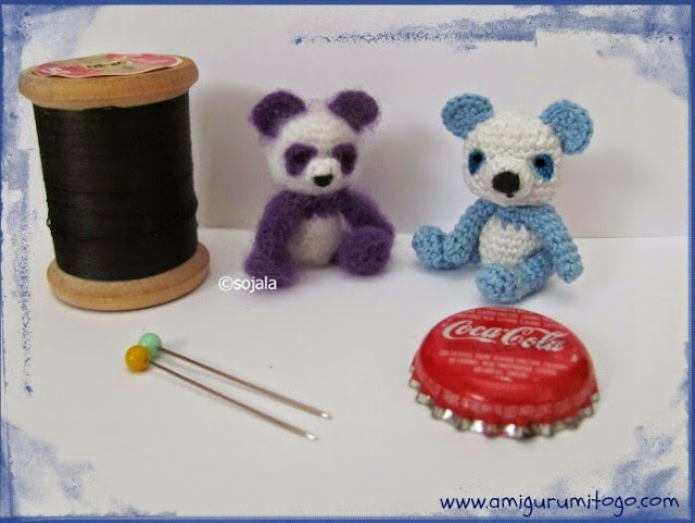 miniature purple and blue panda teddy bears made with crochet thread