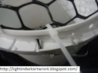 Close up of electrical ties in the top trim of plastic bucket