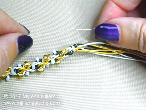 Tying off the end of a Kumihimo braid with sewing thread