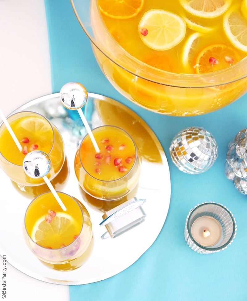 Sparkling Citrus Holiday Sangria Recipe - a perfect big-batch Champagne and fruit cocktail to serve a crowd at your Christmas and end-of-year parties! | BirdsParty.com