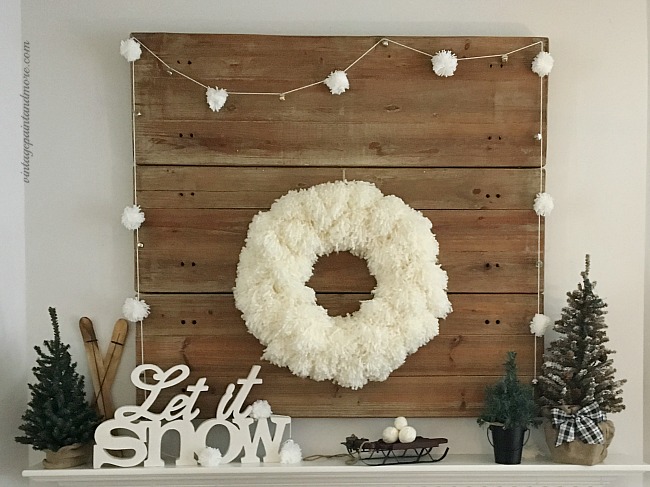 Vintage Paint and more... a winter mantel done with a diy yarn pom-pom wreath and garland and rustic winter snow decor
