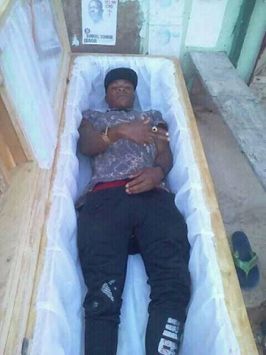 Photo of man posing inside a casket sparks outrage on social media