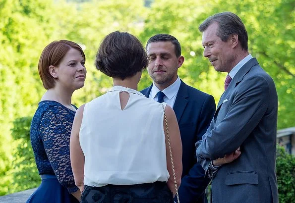 Duke Henri, Maria Teresa, Prince Guillaume and Princess Stephanie at a reception. Maria Teresa wore blue dress, Stephanie wore Prada floral dress