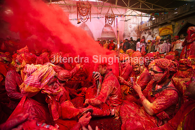 Here comes the very first and rocking PHOTO JOURNEY by Jitendra Singh, one of the great photographers. Photographers at PHOTO JOURNEY welcome Mr. Jitendra Singh and congratulate him for his first PHOTO JOURNEY with great colors. Let's check out these interesting Holi photographs from Barsana, Nandgaon, Goverdhan, Vrindavan and Mathura...The Hindu festival of Holi which is also called as the Festival of Colors celebrated with much enthusiasm in the month of Phalgun, which usually corresponds to the month of March. It marks the arrival of spring and the bright colors represent energy, life, and joy. The festival of colors is also very special for Photographers like Jitendra Singh, who visited one of the important places in India where Holi is celebrated in very special ways. This Photo Journey shares photographs from various parts of Uttar Pradesh.In Mathura, the birthplace of Lord Krishna and in Vrindavan this day is celebrated with special puja and the traditional custom of worshiping Lord Krishna, here the festival lasts for sixteen days. All over the Braj region and its nearby places like Hathras, Aligarh, Agra the Holi is celebrated in more or less same way as in Mathura, Vrindavan and Barsana. This great festival is associated with the immortal love of Lord Krishna and Radha and hence, Holi is spread over 16 days in Nandgaon, Barsana, Goverdhan, Vrindavan as well as Mathura - the cities with which Lord Krishna shared a deep affiliation. Apart from the usual fun with colored powder and water, Holi is marked by vibrant processions which are accompanied by folk songs, dances and a general sense of abandoned vitality. These photographs share the mood of Holi with great enthusiasm, music, dance and lot of excitement in various forms. Barsana is the place to be at the time of Holi. Here the famous Lath mar Holi is played in the sprawling compound of the Radha Rani temple. Thousands gather to witness the Lath Mar holi when women beat up men with sticks as those on the sidelines become hysterical, sing Holi Songs and shout Sri Radhey or Sri Krishna. The Holi songs of Braj mandal are sung in pure Braj BhashaHoli is known by the name of 'Dol Jatra', 'Dol Purnima' or the 'Swing Festival'. The festival is celebrated in a dignified manner by placing the icons of Krishna and Radha on a picturesquely decorated palanquin which is then taken round the main streets of the city or the village. The devotees take turns to swing them while women dance around the swing and sing devotional songs. During these activities, the men keep spraying colored water and colored powder, abir, at them.The Holi celebration has its celebration origins in Gujarat, particularly with dance, food, music, and colored powder to offer a spring parallel of Navratri, Gujarat's Hindu festival celebrated in the fall. Falling on the full moon day in the month of Phalguna, Holi is a major Hindu festival and marks the agricultural season of the Rabi cropOn Dol Purnima day in the early morning, the students dress up in saffron-colored or pure white clothes and wear garlands of fragrant flowers. They sing and dance to the accompaniment of musical instruments like ektara, dubri, veena, etc. Holi played at Barsana is unique in the sense that here women chase men away with sticks. Males also sing provocative songs in a bid to invite the attention of women. Women then go on the offensive and use long staves called lathis to beat men folk who protect themselves with shieldsIn Maharashtra, Holi is mainly associated with the burning of Holika. Holi Paurnima is also celebrated as Shimga. A week before the festival, youngsters go around the community, collecting firewood and money. On the day of Holi, the firewood is arranged in a huge pile at a clearing in the locality. 