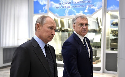 Vladimir Putin with Director of Almaz-Antey Air and Space Defense Corporation General Yan Novikov. Vladimir Putin with Director of Almaz-Antey Air and Space Defense Corporation General Yan Novikov.