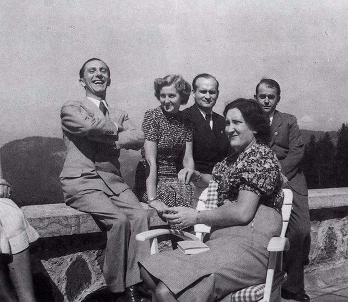 Eva was the life of the party. Here she is with Dr. Goebbels and others. Albert Speer is off to the side looking a bit glum. He was not a big fan of Eva's, and said once, 