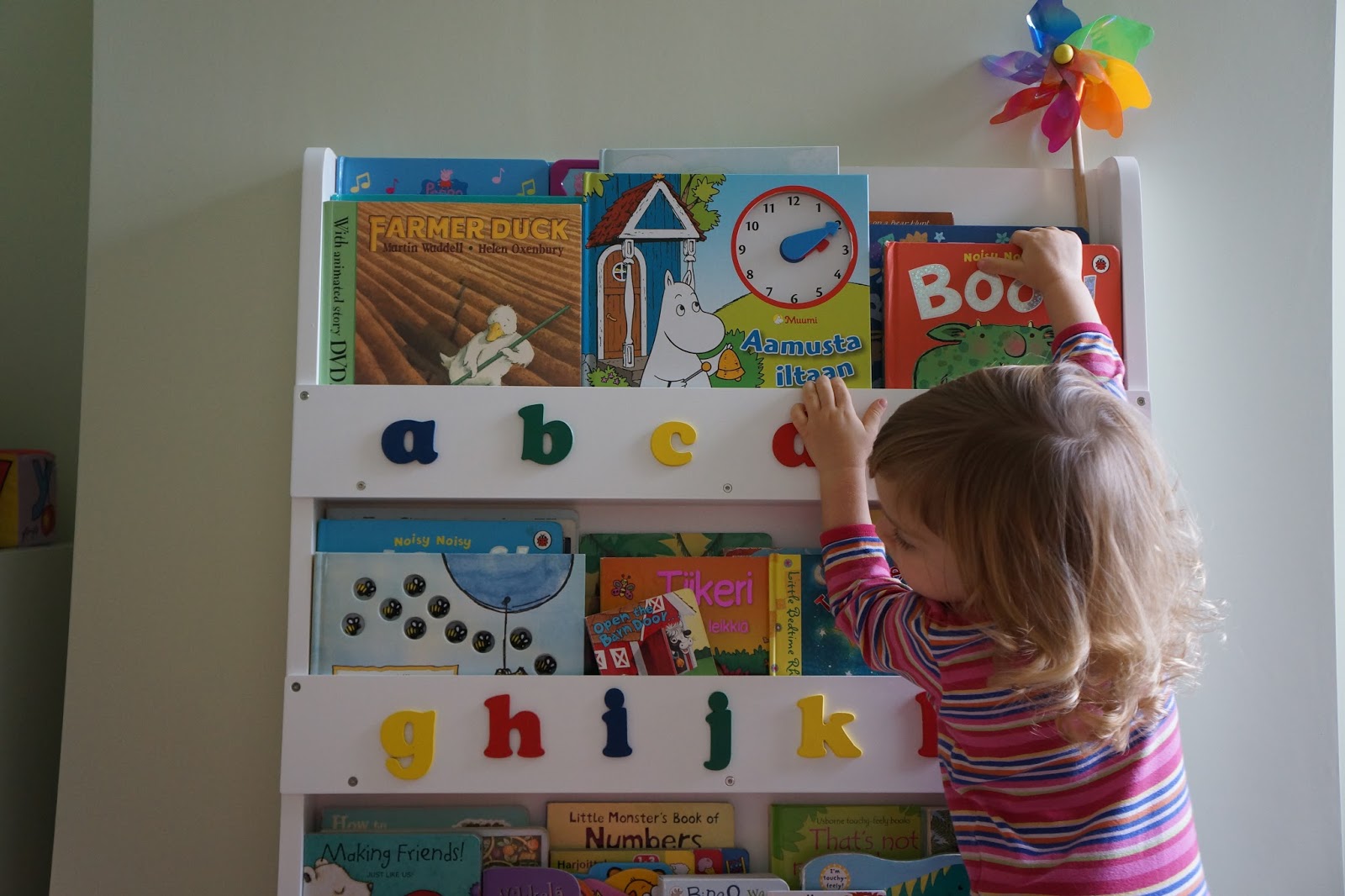 tidy books bookcase toddler reaching for books