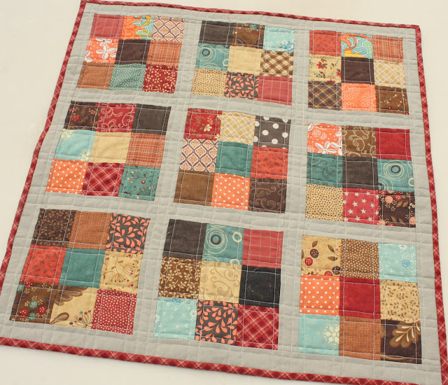 "Giving Thanks Table Topper” is a Free Thanksgiving Quilted Table Patterns designed by Amy Smart from Diary of a Quilter!