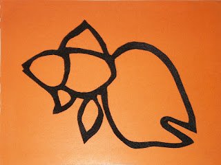 Felt cut-out of goldfish outline