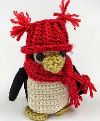 http://www.redheart.com/free-patterns/little-penguin-ornament