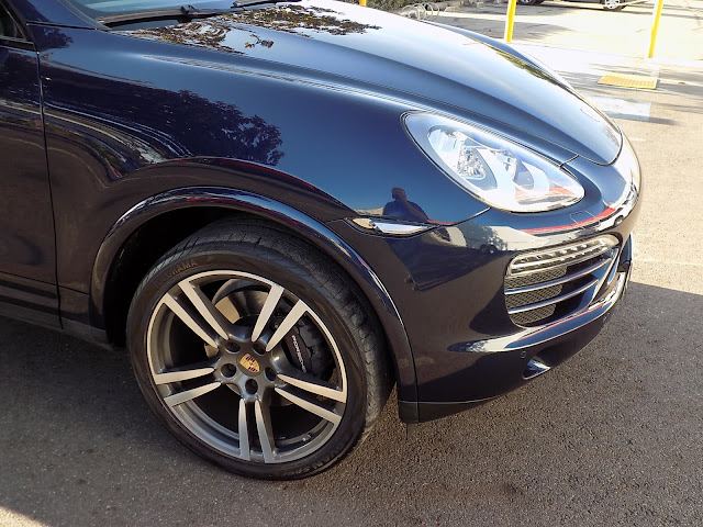 Porsche Cayenne after collision repairs completed at Almost Everything Auto Body.
