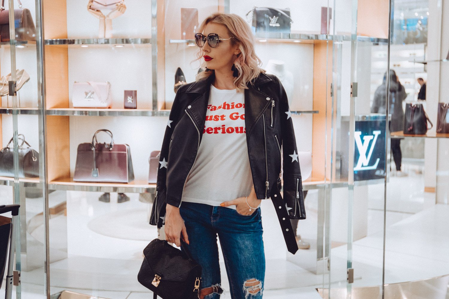 fashion blogger wearing the best faux biker jacket with stars 