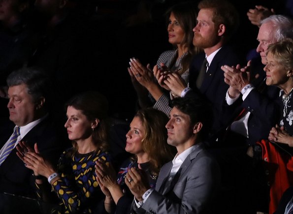 Prince Harry, Melania Trump and Justin Trudeau at Invictus Games. Meghan Markle wore Mackage Baya Leather Jacket and Aritzia Beaune Dress