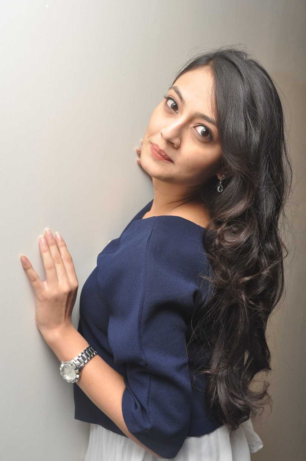 Tollywood Actress Nikitha Narayan Long Hair Smiling Face Photos In Blue Top