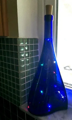 Recycled bottles with colored fairy lights