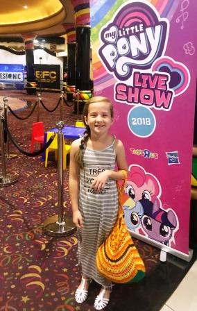 MY Little Pony Live Show - pose Girl posing in front of MLP Live Show poster