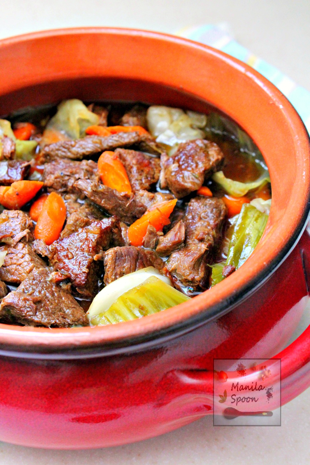 Beef chunks are steeped in Belgian beer in the slow cooker and results in a melt-in-your-mouth delicious stew! This is the best beef stew ever! | manilaspoon.com