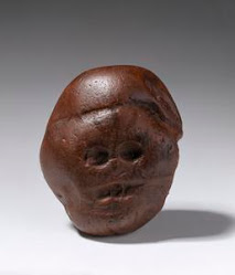 Makapansgat, S.A. "Pebble of many faces" was likely a manuported natural stone 3 million years ago
