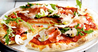 Classic light and crispy pizza base topped with red sauce, ham, mushrooms and rocket (arugula) leaves