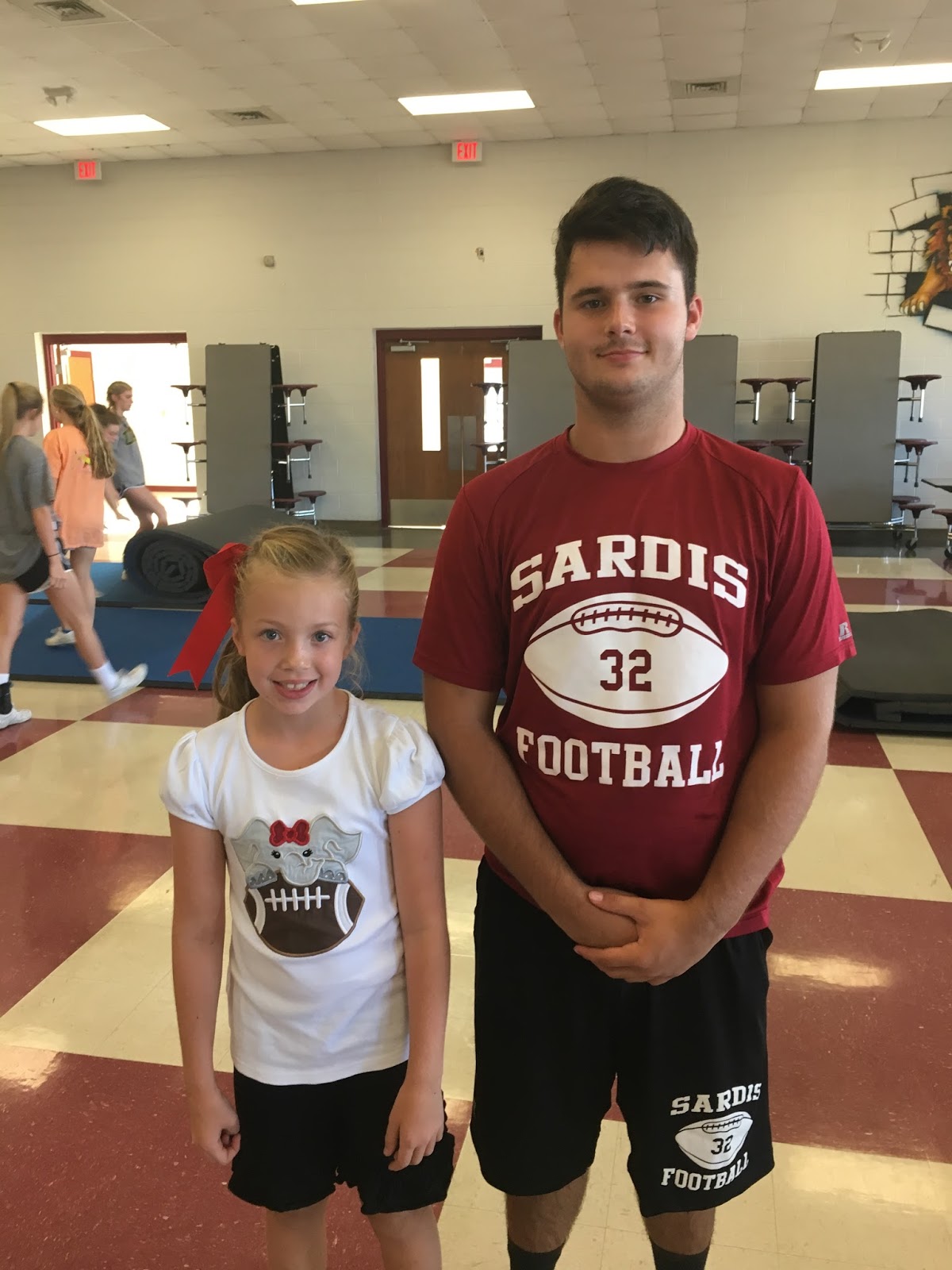 Maggie Elizabeth Feeding the Football Team