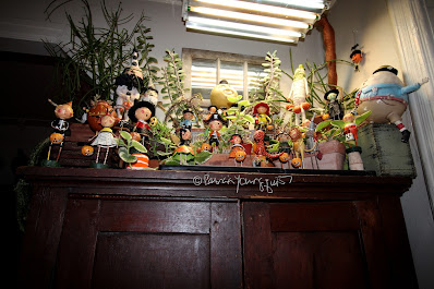 This photo features an array of whimsical figurines depicting  trick or treaters