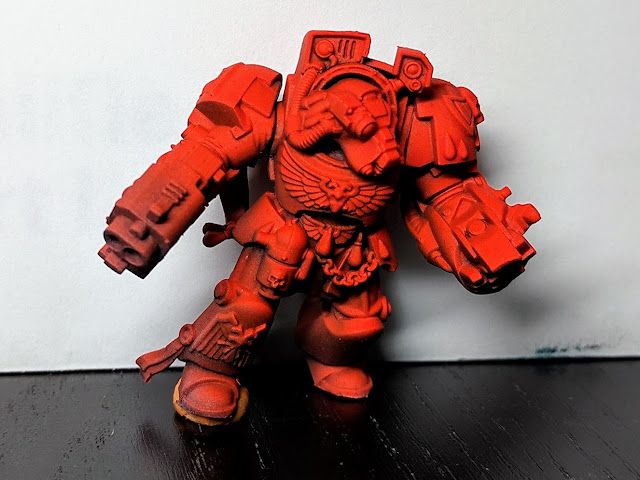Brother Omnia red and glowy, ready the details to be painted. Space Marine terminator complete with shaded red.
