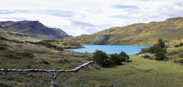 Boardwalk and blue lake view in Torres del Paine National Park on the Salto Chico Trail