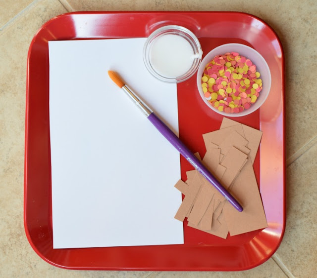 Fall tree craft for toddlers, preschoolers, or kindergartners.  Use hole punch circles in red, orange, and yellow to make autumn leaves!  Great fine motor work!
