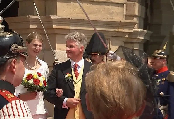 Princess Stephanie of Saxe-Coburg and Gotha wore a white silk wedding dress from German fashion designer Gordon Sieverding, who is based in Michelau