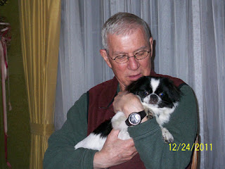 Dad Holding Oliver in 2011 in our Dining Room.