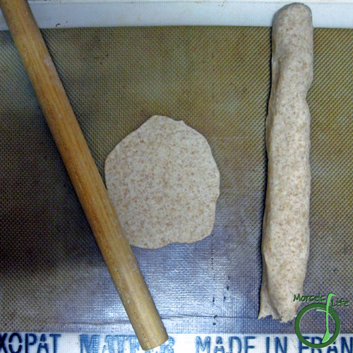 Morsels of Life - Potato and Cheese Pierogies Step 7 - Form dough into a log with a diameter of about 1 inch. Pull of a 1 inch segment and roll out.