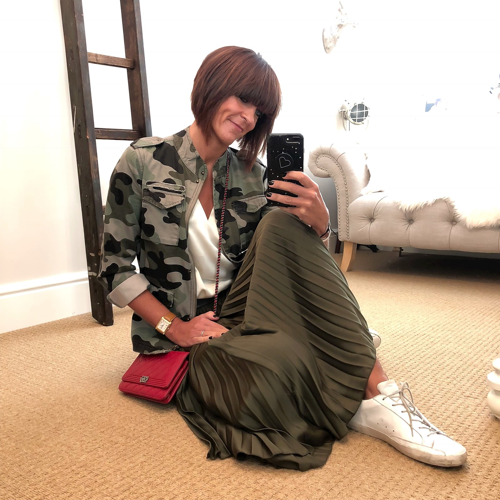 my midlife fashion, hush camouflage military jacket, chanel wallet on chain, marks and spencer silk v neck top, golden goose superstar low top leather trainers, marks and spencer satin pleated midi skirt