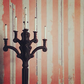 One-twelfth scale wrought-iron candelabra with candles.