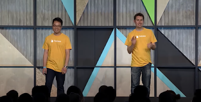 Francis Ma and James Tamplin standing on stage.