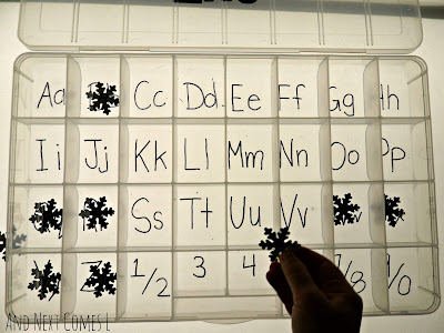 Matching and sorting alphabet snowflakes on the light table from And Next Comes L