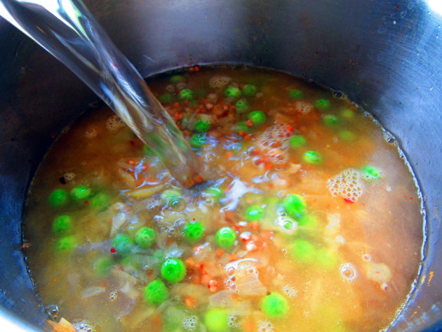 Buckwheat and green pea soup by Laka kuharica: add buckwheat, green peas, turmeric and vegetable stock