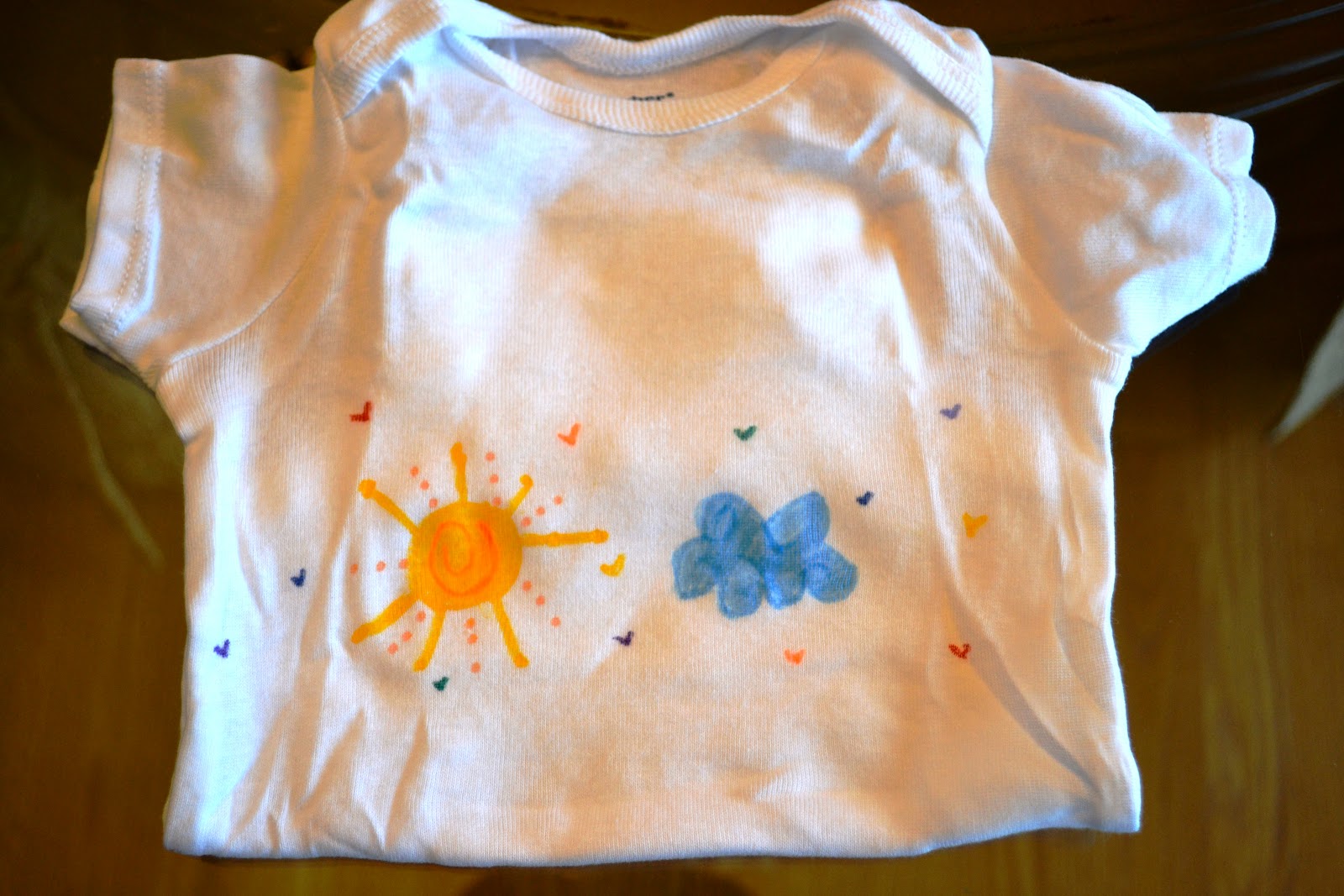 Sweetology Giving Back Fabric Marker Decorated Baby Onesies