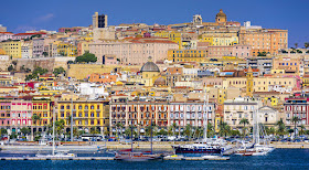 The port of Cagliari rises from the sea to provide a  colourful sight for approaching travellers