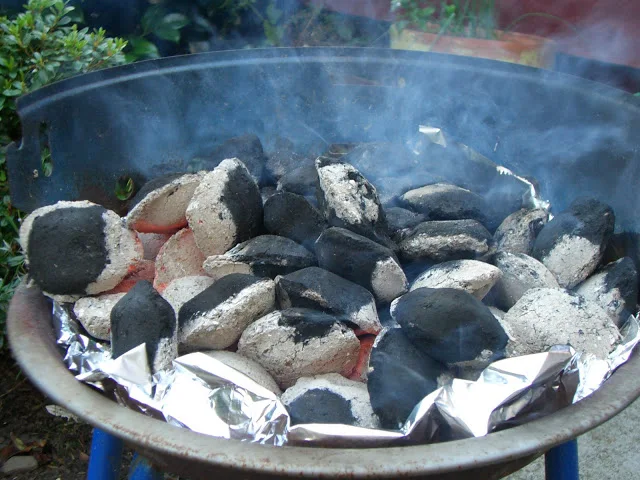 Glowing coals on a BBQ