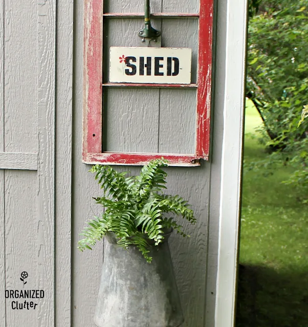 Decorating a Home Depot Shed Kit with JUNK #junkgarden #gardenjunk #flowergarden #containergarden #oldsignstencils #stencils