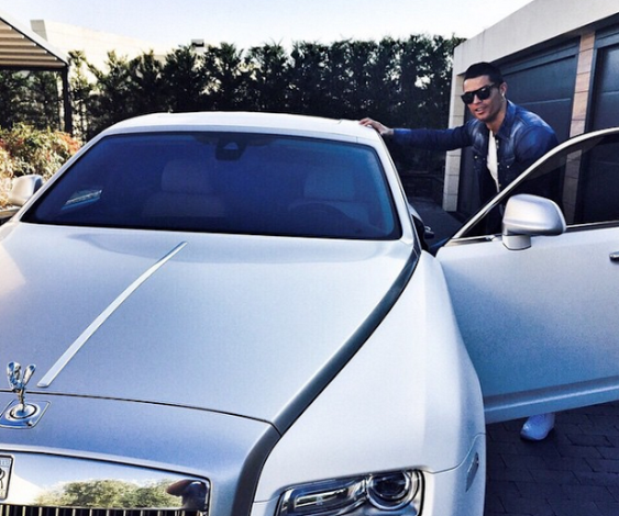 1 Cristiano Ronaldo shows off his Rolls Royce as he goes for training