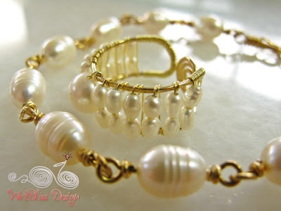 A pearl bracelet and adjustable wire wrap ring, with tiny pearls