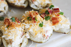 These loaded twice baked potatoes are packed with bacon, cheddar, and sour cream. They're incredibly delicious and so easy to make!